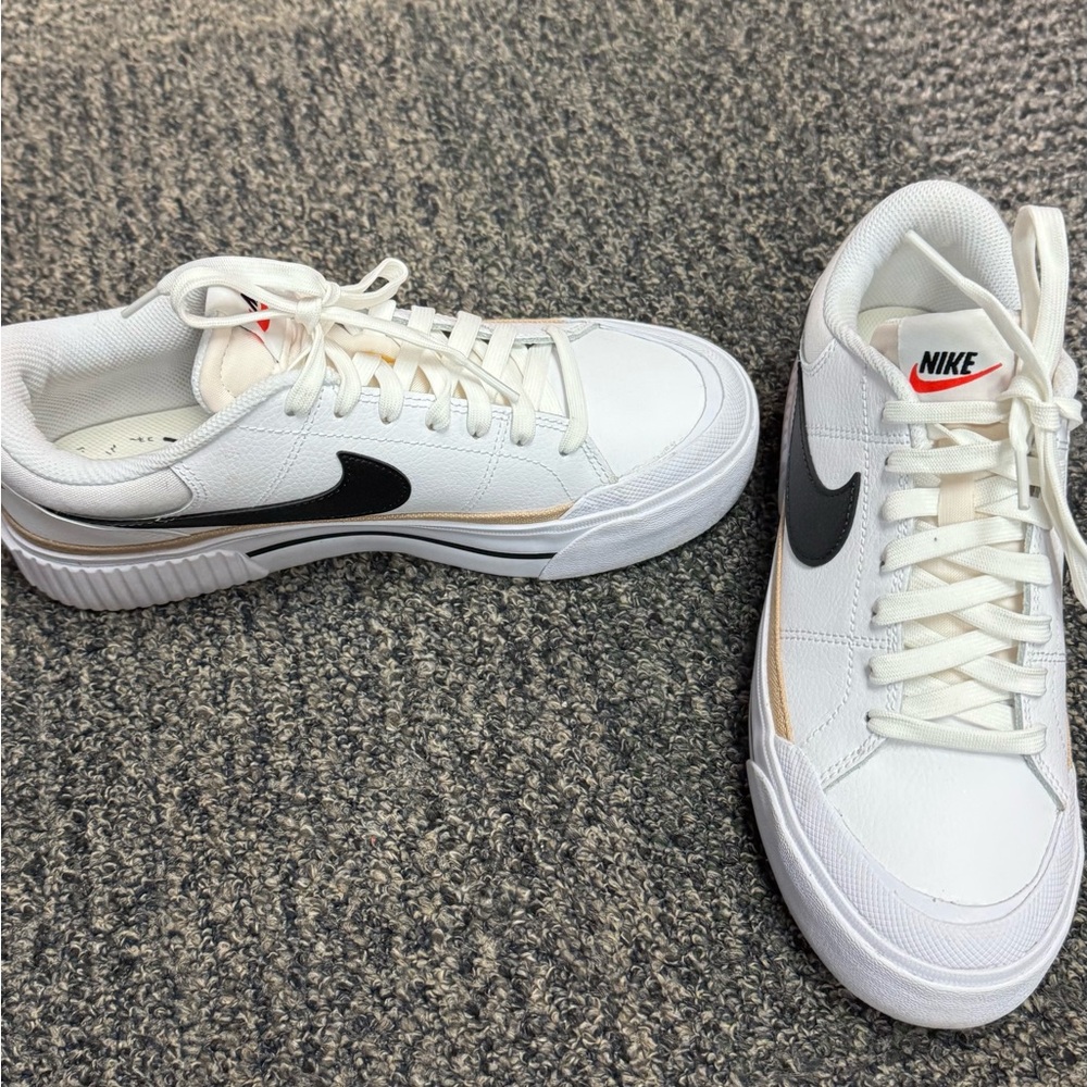 Nike White Sneakers with Black Swoosh